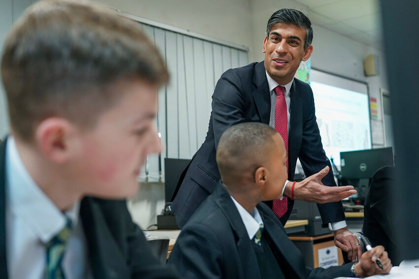 Britain's Prime Minister Rishi Sunak meets students as he visits Haughton Academy to outline plans for the banning of single use vapes, in Darlington, England, on Jan. 29, 2024. (Ian Forsyth/Pool Photo via AP, File)