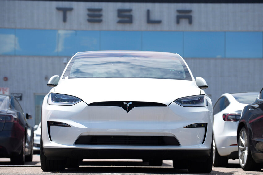 A 2023 Model X sits outside a Tesla dealership on June 18, 2023, in Englewood, Colo. (AP Photo/David Zalubowski, File)