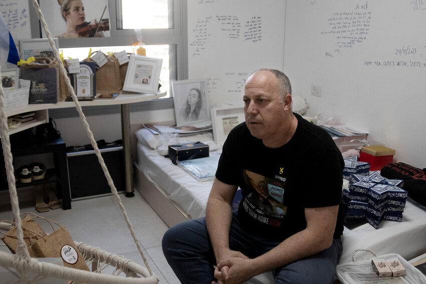 Shlomi Berger sits in his daughter Agam's bedroom in Holon, Israel, Wednesday, April 17, 2024. Agam was abducted two days after the start of her army service along the border with Gaza. (AP Photo/Maya Alleruzzo)