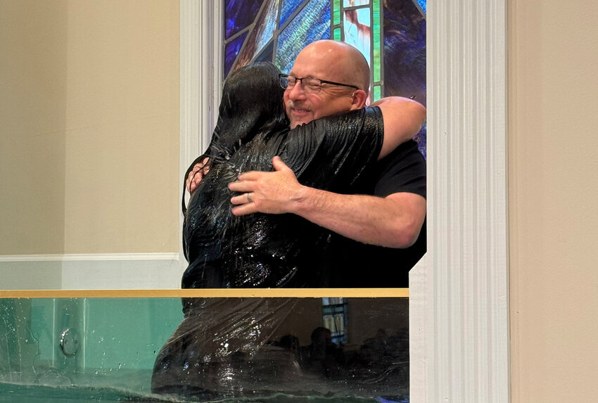 Macedonia Baptist Church pastor Wade Lott embraces a newly baptized believer. (Photo/Macedonia Baptist Church)