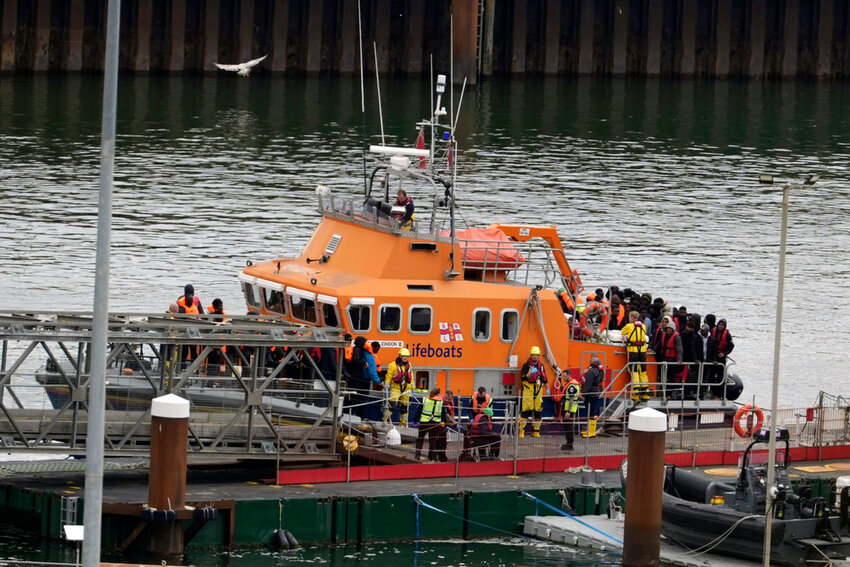 A group of people thought to be migrants are brought in to Dover, Kent, by the Border Force following a small boat incident in the Channel, on Tuesday, April 23, 2024. (Gareth Fuller/PA via AP)