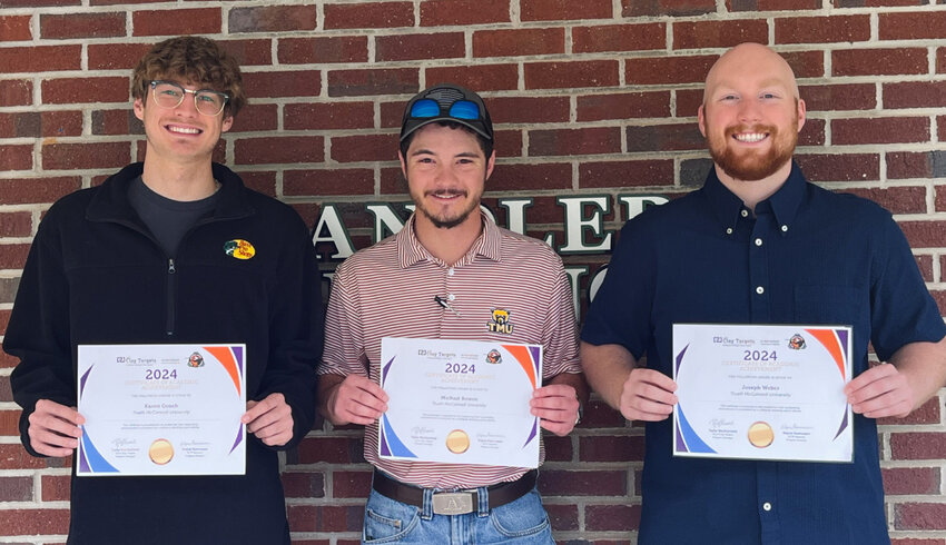 Truett McConnell shooting team members Kason Gooch, Michael Bowen and Drew Weber, from left, pose with their certificates. (Photo/TMU)
