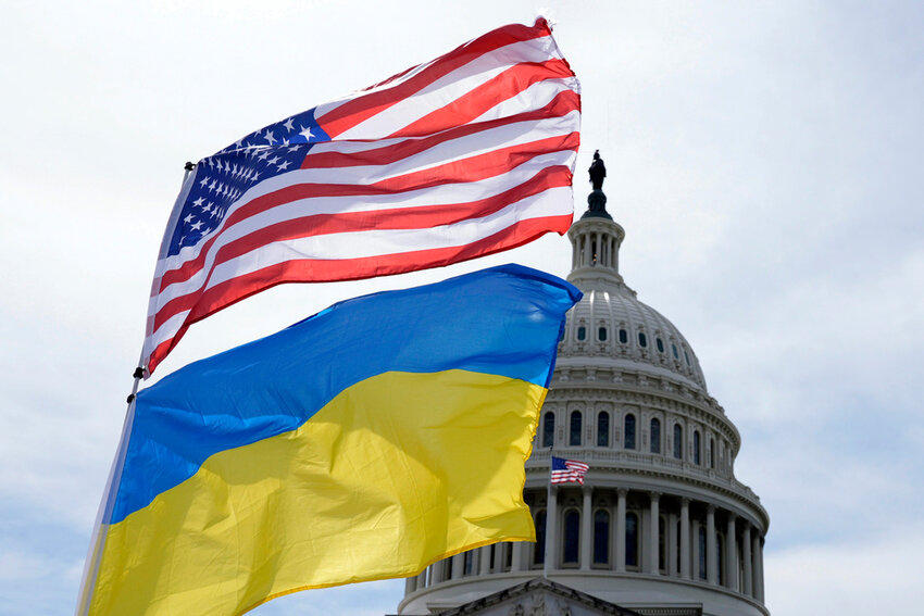 The American and Ukrainian flags wave in the wind outside of the Capitol on Tuesday, April 23, 2024, in Washington. (AP Photo/Mariam Zuhaib)