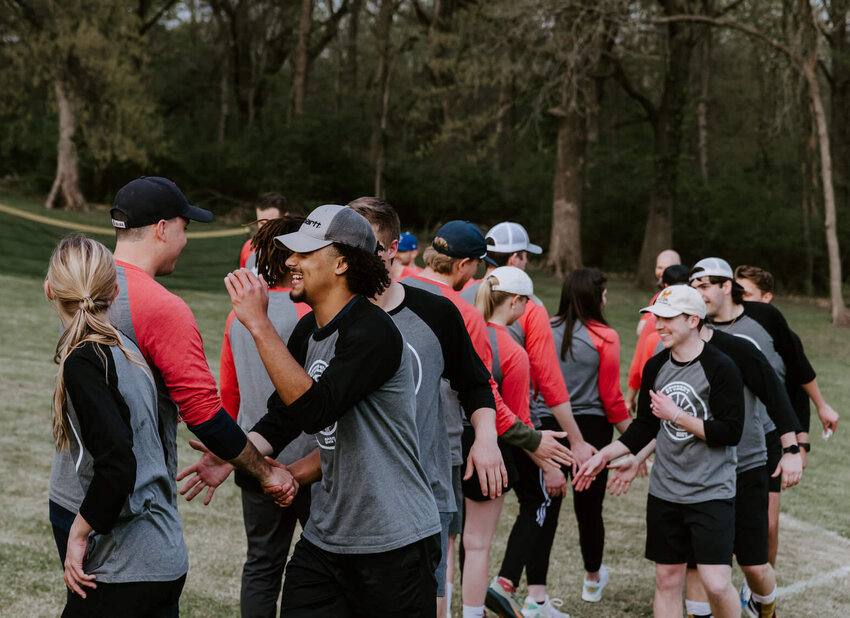 Players shake hands after the annual student vs. faculty and staff wiffle ball game at Midwestern Seminary's Spring Picnic. (Photo/MBTS)