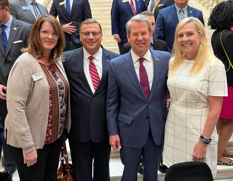 Lorna Bius, a Mission Georgia mobilizer, and Mike Griffin, Public Affairs representative of the Georgia Baptist Mission Board, pose beside Gov. Brian Kemp and his wife Marty, right, at a bill signing ceremony. (Index/Courtesy of Mike Griffin)