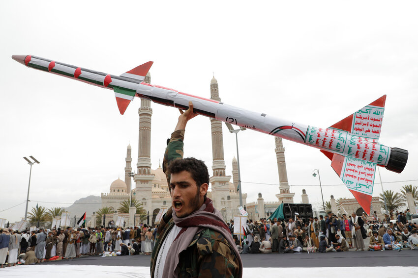 A Houthi supporter raises a mock rocket during a rally against the U.S. and Israel and to support Palestinians in the Gaza Strip, in Sanaa, Yemen, April 26, 2024. (AP Photo/Osamah Abdulrahman, File)