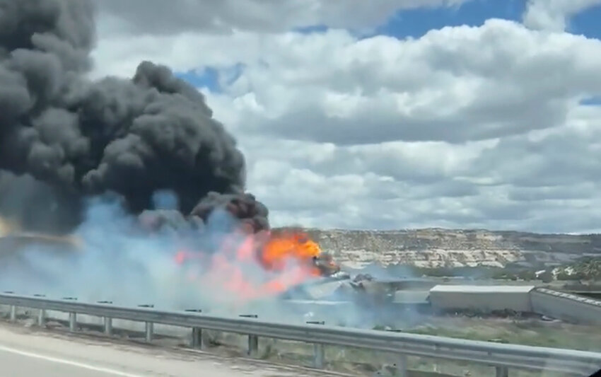 This frame grab taken from video provided by Bryan Wilson shows a freight train carrying fuel that derailed and caught fire, Friday, April 26, 2024, near the New Mexico-Arizona state line, east of Lupton, Ariz. (Bryan Wilson via AP)