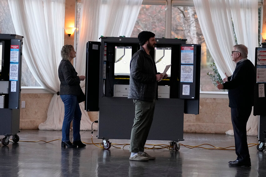 People vote at a polling site for the presidential primary election on Tuesday, March 12, 2024, in Atlanta. (AP Photo/Brynn Anderson, File)