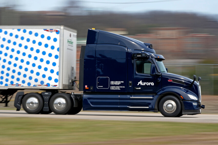 A self-driving tractor trailer maneuvers around a test track in Pittsburgh, Thursday, March 14, 2024. (AP Photo/Gene J. Puskar)