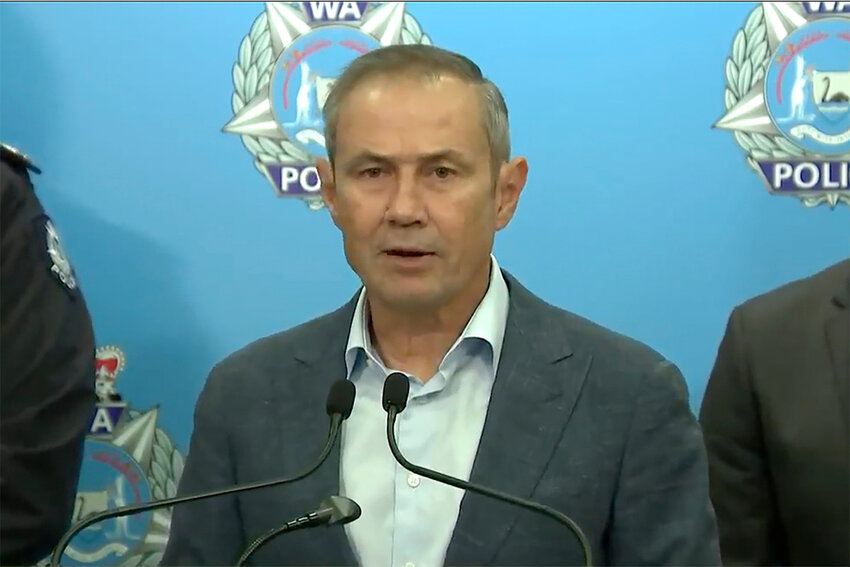 In this image from a video, Western Australian Premier Roger Cook speaks at a press conference in Perth, Australia Sunday, May 5, 2024. A 16-year-old boy armed with a knife was shot dead by police after he stabbed a man in the Australian west coast city of Perth, officials said Sunday. (Australian Broadcasting Corporation via AP)