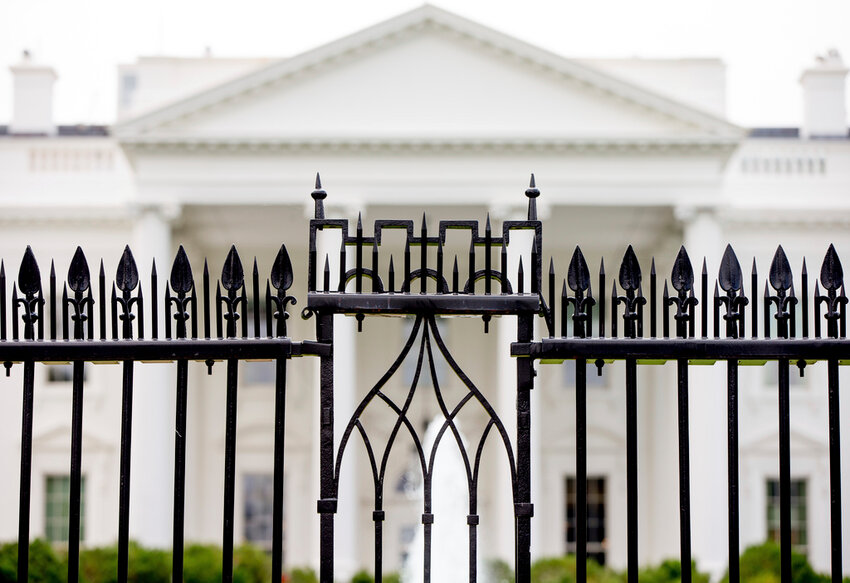 The White House is visible through the fence at the North Lawn in Washington, on June 16, 2016. (AP Photo/Andrew Harnik, File)