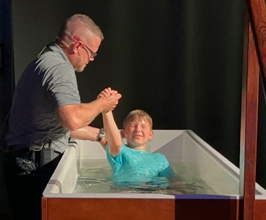 Pastor Kevin Vaughn baptizes a new believer. (Photo/Rock Branch Baptist Church)