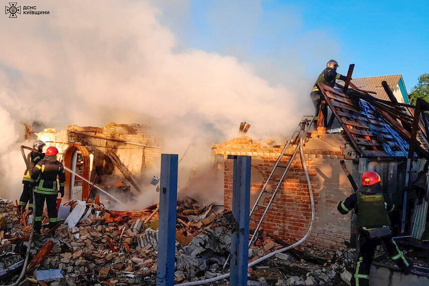 Rescuers work at a damaged building after a Russian missile attack in Kyiv region, Ukraine, Wednesday, May 8, 2024. (Ukrainian Emergency Service via AP Photo)