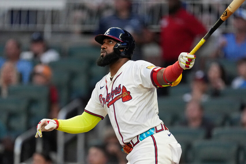 Atlanta Braves designated hitter Marcell Ozuna (20) follows through on a home run in the third inning against the Boston Red Sox, Wednesday, May 8, 2024, in Atlanta. (AP Photo/John Bazemore)