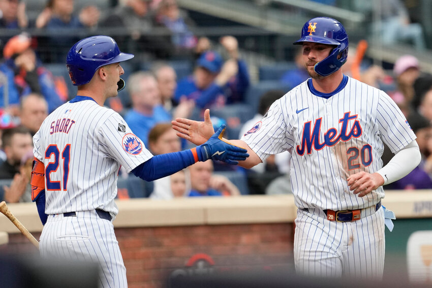 New York Mets' Pete Alonso (20) celebrates with Zack Short (21) after scoring on a two-run single by Tyrone Taylor during the sixth inning against the Pittsburgh Pirates, Wednesday, April 17, 2024, in New York. (AP Photo/Mary Altaffer, File)