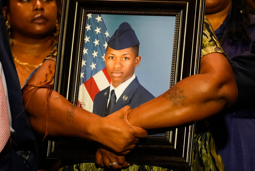 Chantemekki Fortson, U.S. Air Force airman Roger Fortson, holds a photo of her son during a news conference regarding his death Thursday, May 9, 2024, in Fort Walton Beach, Fla. (AP Photo/Gerald Herbert)