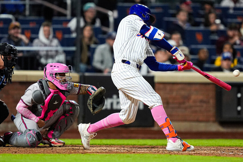New York Mets' Brandon Nimmo (9) hits a game-winning two-run home run during the ninth inning against the Atlanta Braves, Sunday, May 12, 2024, in New York. (AP Photo/Julia Nikhinson)