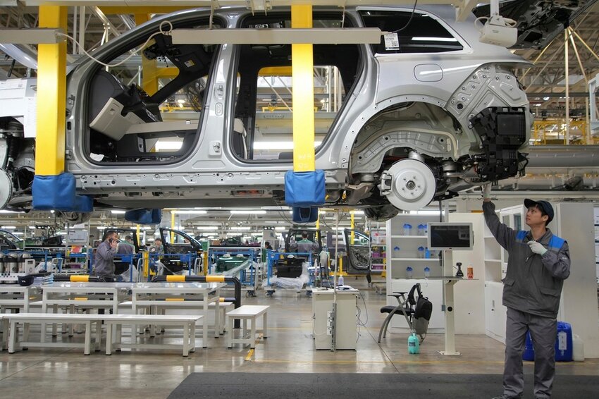 A worker assembles an SUV at a car plant of Li Auto, a major Chinese EV maker, in Changzhou in eastern China's Jiangsu province on March 27, 2024. (Chinatopix Via AP, File)