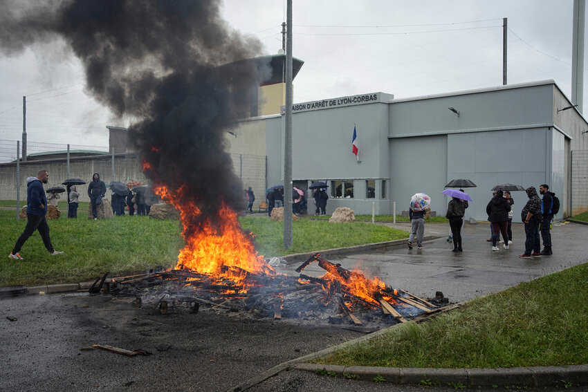 Prison workers gather during a protest outside the Corbas prison, outside Lyon, France, Wednesday, May 15, 2024.  (AP Photo/Laurent Cirpiani)