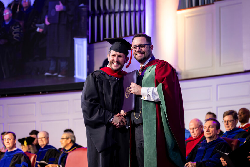 Jamie Dew (right), president of New Orleans Baptist Theological Seminary and Leavell College, spoke to graduates about what has “real, significant value” in the Kingdom of God during commencement ceremonies Friday, May 10. (Photo/NOBTS)
