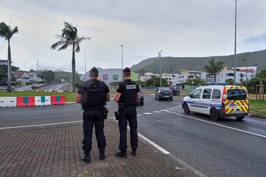 French gendarmes patrol at a roundabout in Noumea, New Caledonia, Sunday Dec.12, 2021. (AP Photo/Clotilde Richalet, File)