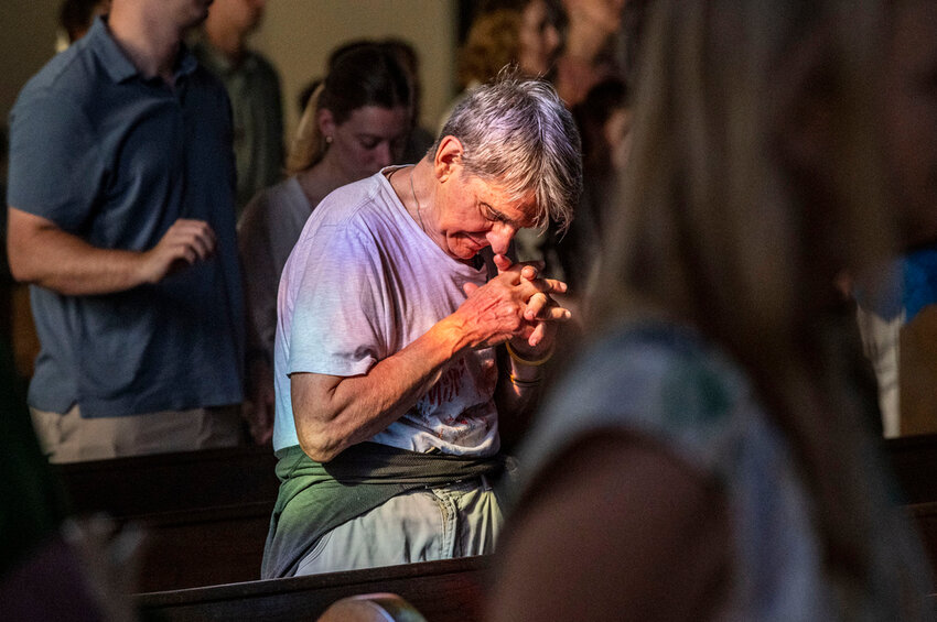 Parishioners endured no lights and no air conditioning to worship during Sunday morning 8:30 mass, May 19, 2024, at All Saints Catholic Church, in Houston, due to a lack of electric power following severe storms that passed through the area Thursday evening. (Kirk Sides/Houston Chronicle via AP)