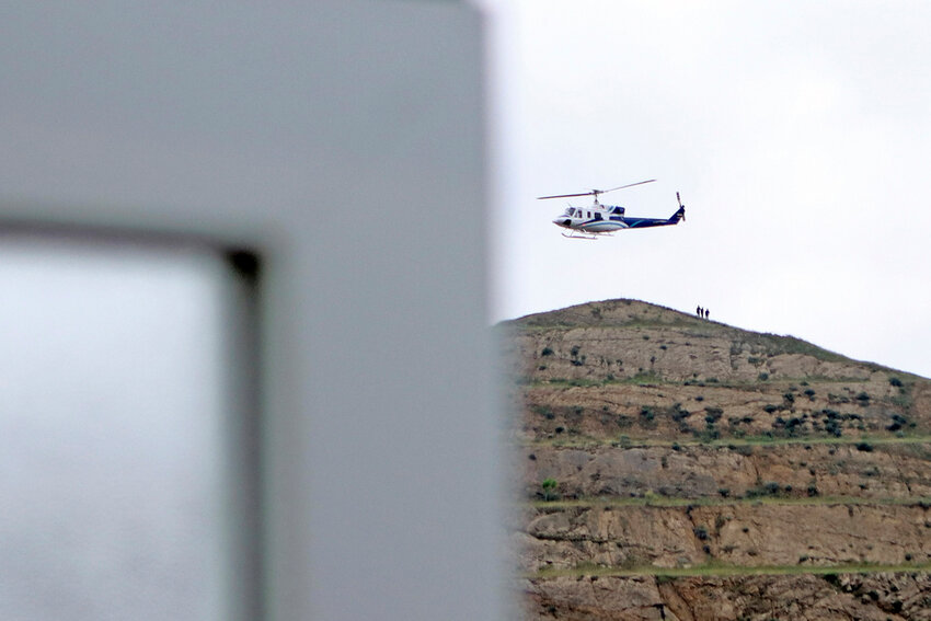 In this photo provided by Islamic Republic News Agency, IRNA, the helicopter carrying Iranian President Ebrahim Raisi takes off at the Iranian border with Azerbaijan after President Raisi and his Azeri counterpart Ilham Aliyev inaugurated the dam of Qiz Qalasi, or Castel of Girl in Azeri, Iran, Sunday, May 19, 2024. A helicopter carrying President Raisi suffered a 