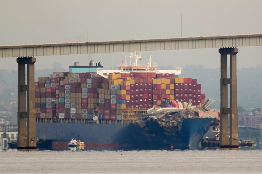 Tugboats escort the cargo ship Dali after it was refloated in Baltimore, Monday, May 20, 2024. The container ship that caused the deadly collapse of Baltimore's Francis Scott Key Bridge was refloated Monday and has begun slowly moving back to port. (AP Photo/Matt Rourke)