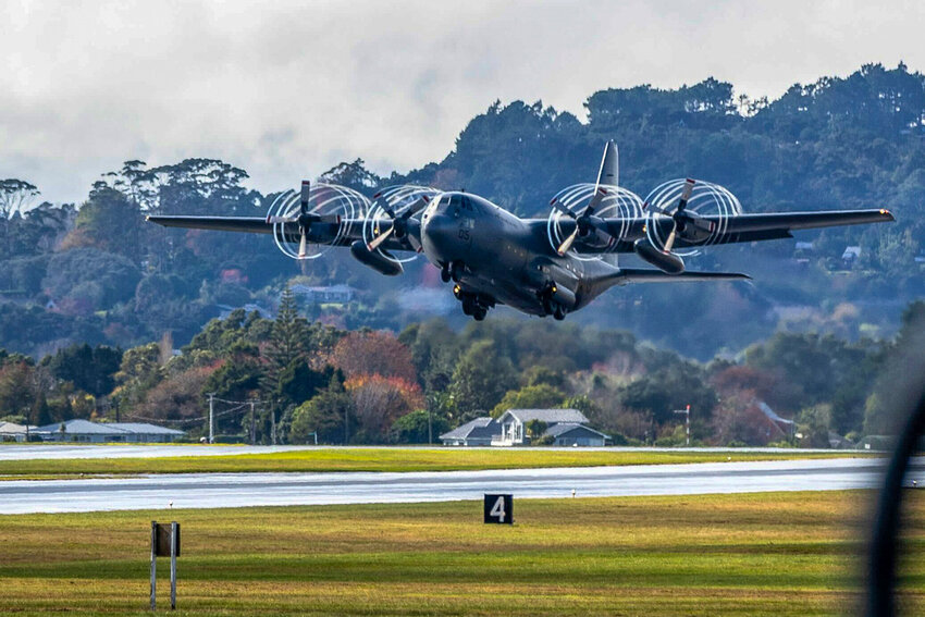 A RNZAF Hercules C-130 takes off from Whenuapai airbase near Auckland, New Zealand, bound for Noumea, New Caledonia, on a mercy mission to rescue stranded New Zealand tourists, Tuesday, May 21, 2024. (Michael Craig/NZ Herald via AP)