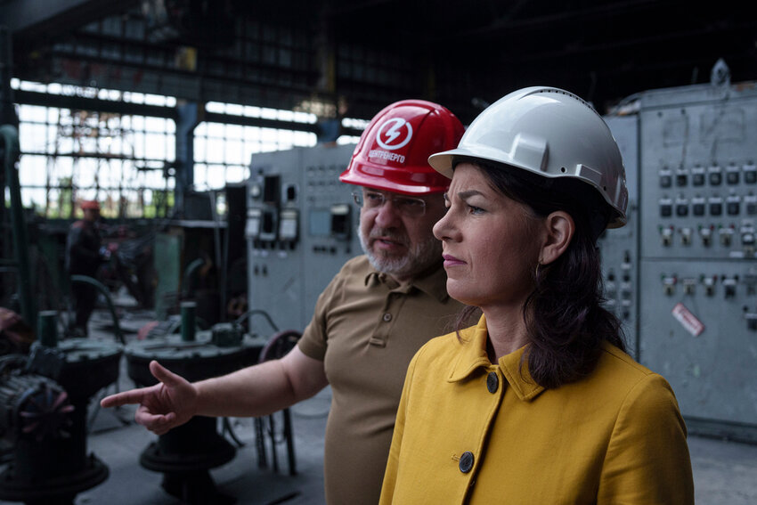 German's Foreign Minister Annalena Baerbock speaks to Ukrainian Energy Minister Herman Halushchenko during official visit to a thermal power plant which was destroyed by a Russian rocket attack in Ukraine, Tuesday, May 21, 2024. (AP Photo/Evgeniy Maloletka)