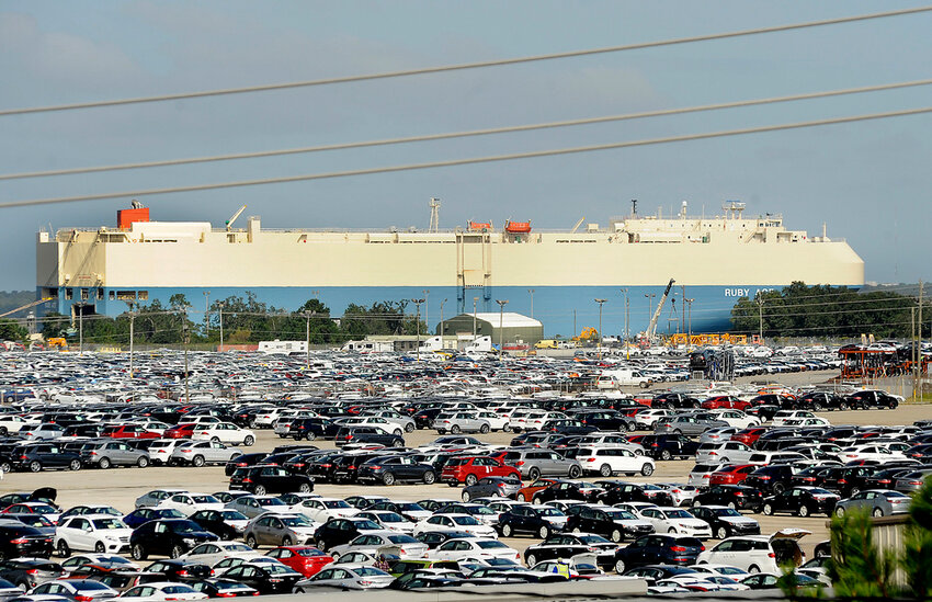 FILE - New automobiles being shipped through the Port of Brunswick sit in a vast parking lot at the Colonel's Island terminal in Brunswick, Ga., Oct. 20, 2015. The Georgia Ports Authority says a surge in auto imports rerouted from Baltimore led to its busiest month ever for car and truck shipments. The Georgia agency's chief executive said Tuesday, May 21, 2024, that the Port of Brunswick saw more than 80,000 automobiles and heavy machinery units move across its docks in April. (Bobby Haven/The Brunswick News via AP, File)