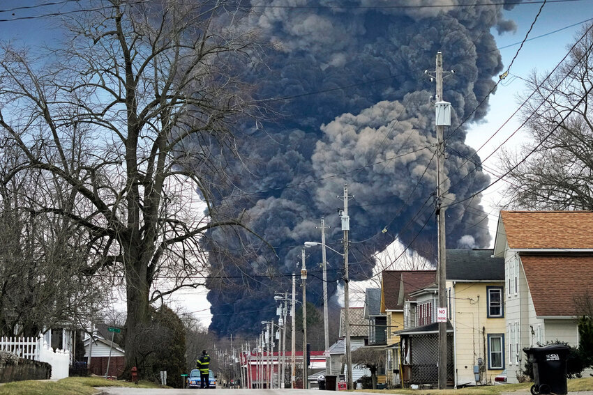 FILE - A black plume rises over East Palestine, Ohio, as a result of the controlled detonation of a portion of the derailed Norfolk Southern trains Monday, Feb. 6, 2023. A federal judge on Tuesday, May 21, 2024, has signed off on the $600 million class action settlement over last year's disastrous Norfolk Southern derailment in eastern Ohio, but many people who live near East Palestine are still wondering how much they will end up with out of the deal. (AP Photo/Gene J. Puskar, File)