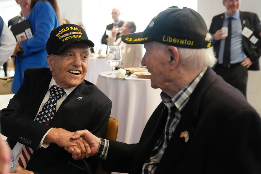 World War II veterans Andy Negra, left, and Hilbert Margol, attend an event honoring the two on Thursday, March 14, 2024, in Atlanta. (AP Photo/Brynn Anderson)