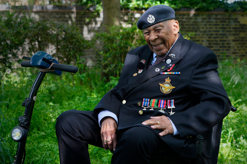 Gilbert Clarke a D-Day veteran smiles near his home in east London, May 15, 2024. (AP Photo/Kirsty Wigglesworth)