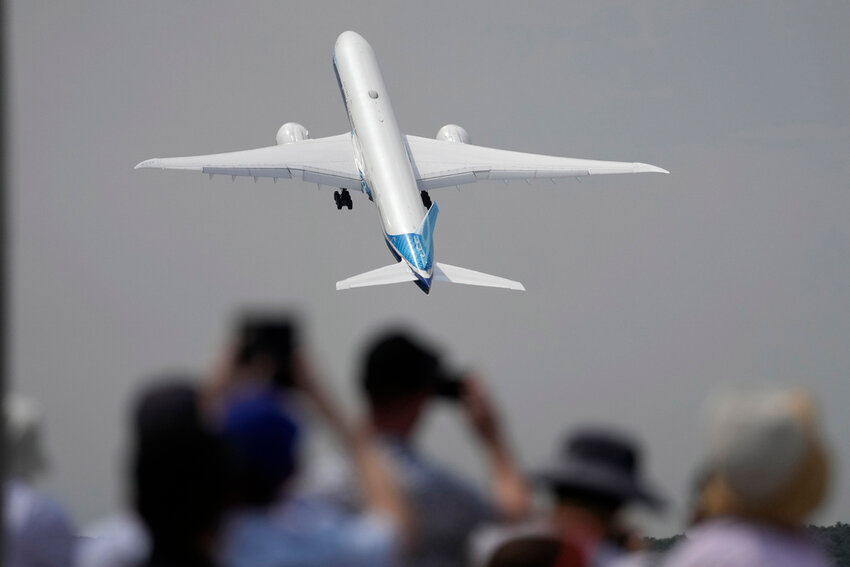 A Boeing 777X plane takes off at the Farnborough Air Show fair in Farnborough, England, on July 18, 2022. (AP Photo/Frank Augstein, File)