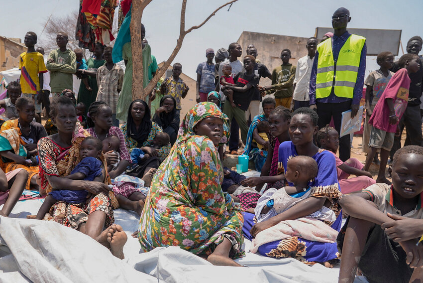 South Sudanese who fled from Sudan sit outside a nutrition clinic at a transit center in Renk, South Sudan, May 16, 2023. (AP Photo/Sam Mednick, File)