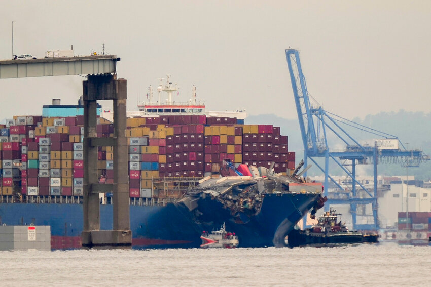 Tugboats escort the cargo ship Dali after it was refloated in Baltimore, Monday, May 20, 2024.  (AP Photo/Matt Rourke)
