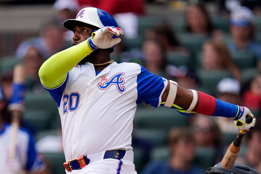 Atlanta Braves designated hitter Marcell Ozuna follows through on a home run in the fifth inning of a baseball game against the Tampa Bay Rays Saturday, June 15, 2024, in Atlanta. (AP Photo/John Bazemore)