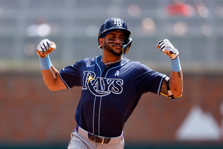 Tampa Bay Rays' Jose Siri celebrates as he rounds the bases after hitting a two-run homer during the ninth inning against the Atlanta Braves, Sunday, June 16, 2024, in Atlanta. (AP Photo/Butch Dill)
