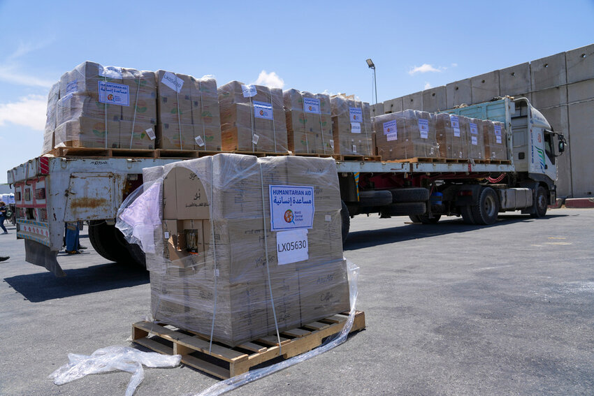 Humanitarian aid for the Gaza Strip with the logo of World Central Kitchen sits on a truck at the Kerem Shalom border crossing in southern Israel, Thursday, May 30, 2024. (AP Photo/Tsafrir Abayov, File)
