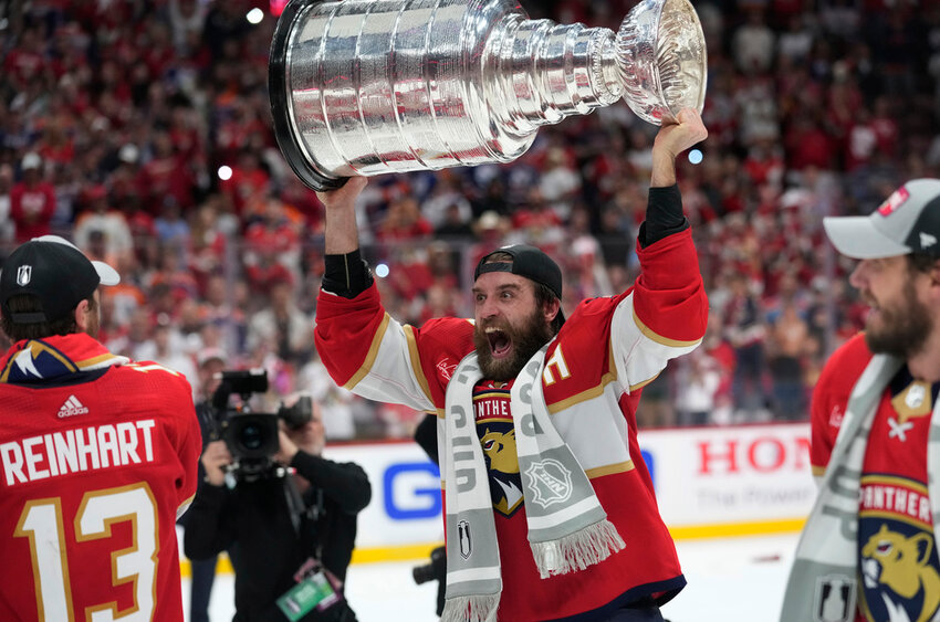 Florida Panthers defenseman Aaron Ekblad raises the Stanley Cup after defeating the Edmonton Oilers in Game 7, Monday, June 24, 2024, in Sunrise, Fla. (AP Photo/Wilfredo Lee)