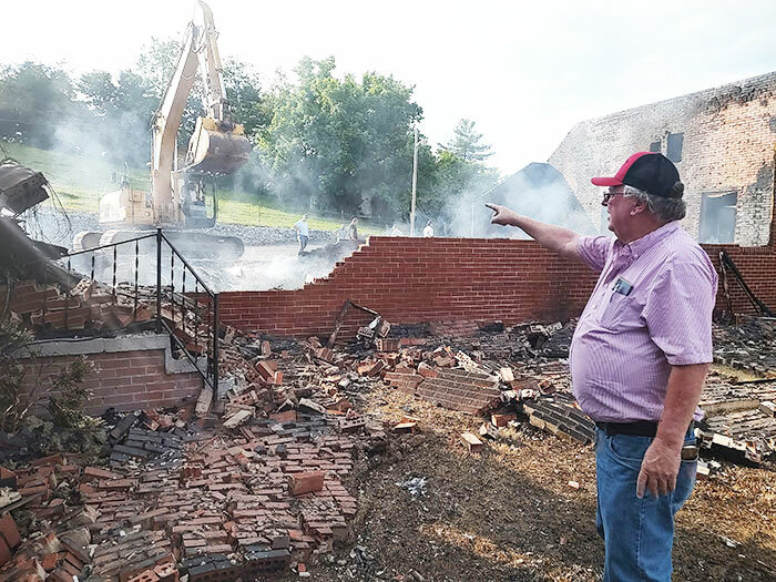 David Majors, a member of Springdale Baptist Church for 55 years, points out where the original building, constructed in 1882, was located. Fire destroyed the building, which had been added onto over the years, in the early evening hours of June 1. (Photo/Baptist and Reflector)