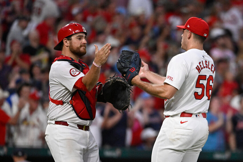 St. Louis Cardinals catcher Pedro Pages, left, celebrates with Ryan Helsley after the team's win over the Atlanta Braves in the second game of a doubleheader Wednesday, June 26, 2024, in St. Louis. (AP Photo/Joe Puetz)