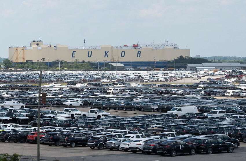 Thousands of new cars are seen in the port of Brunswick beside the vehicle carrier Morning Claire on June 7, 2024. (Index/Henry Durand)