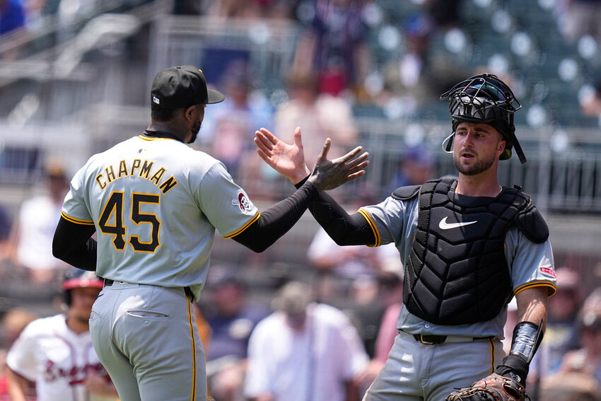 Pittsburgh Pirates catcher Joey Bart and pitcher Aroldis Chapman celebrate a win against the Atlanta Braves, Sunday, June 30, 2024, in Atlanta. (AP Photo/Brynn Anderson)