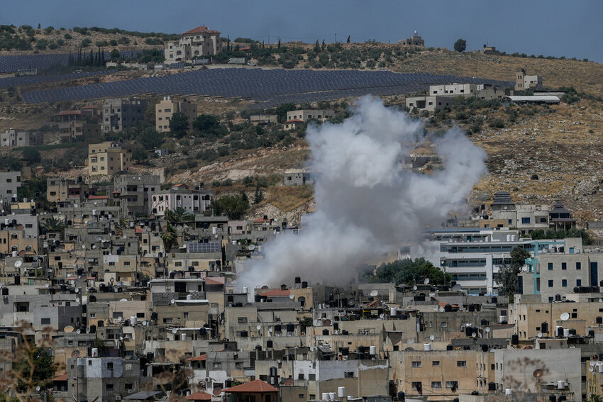 Smoke rises from a building in the West Bank following an Israeli military raid, Monday, June 10, 2024. (AP Photo/File)