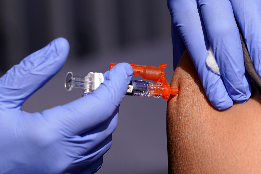 A patient is given a flu vaccine Oct. 28, 2022, in Lynwood, Calif. (AP Photo/Mark J. Terrill, File)