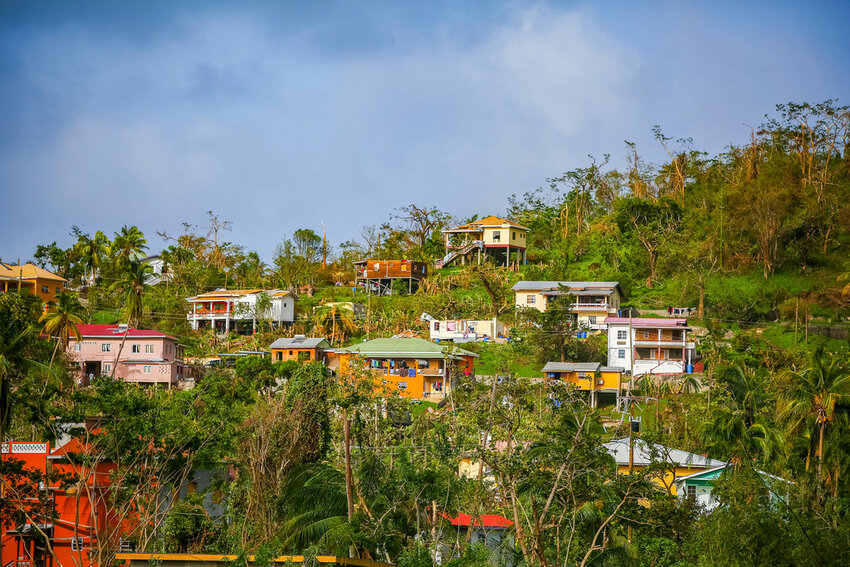 Roofs of houses lie damaged by Hurricane Beryl in St. Patrick, Grenada, Tuesday, July 2, 2024. (AP Photo/Haron Forteau)