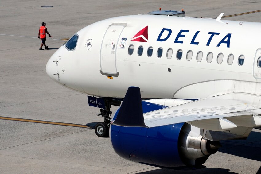 A Delta Air Lines jet leaves the gate, Friday, July 19, 2024, at Logan International Airport in Boston. (AP Photo/Michael Dwyer)