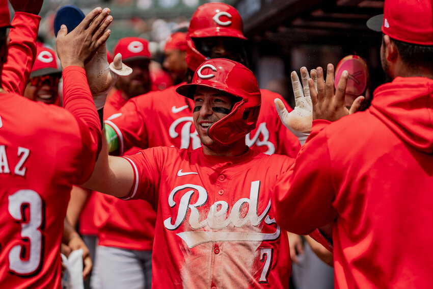 Cincinnati Reds' Spencer Steer (7) celebrates in the dugout after scoring a run in the first inning against the Atlanta Braves, Wednesday, July 24, 2024, in Atlanta. (AP Photo/Jason Allen)